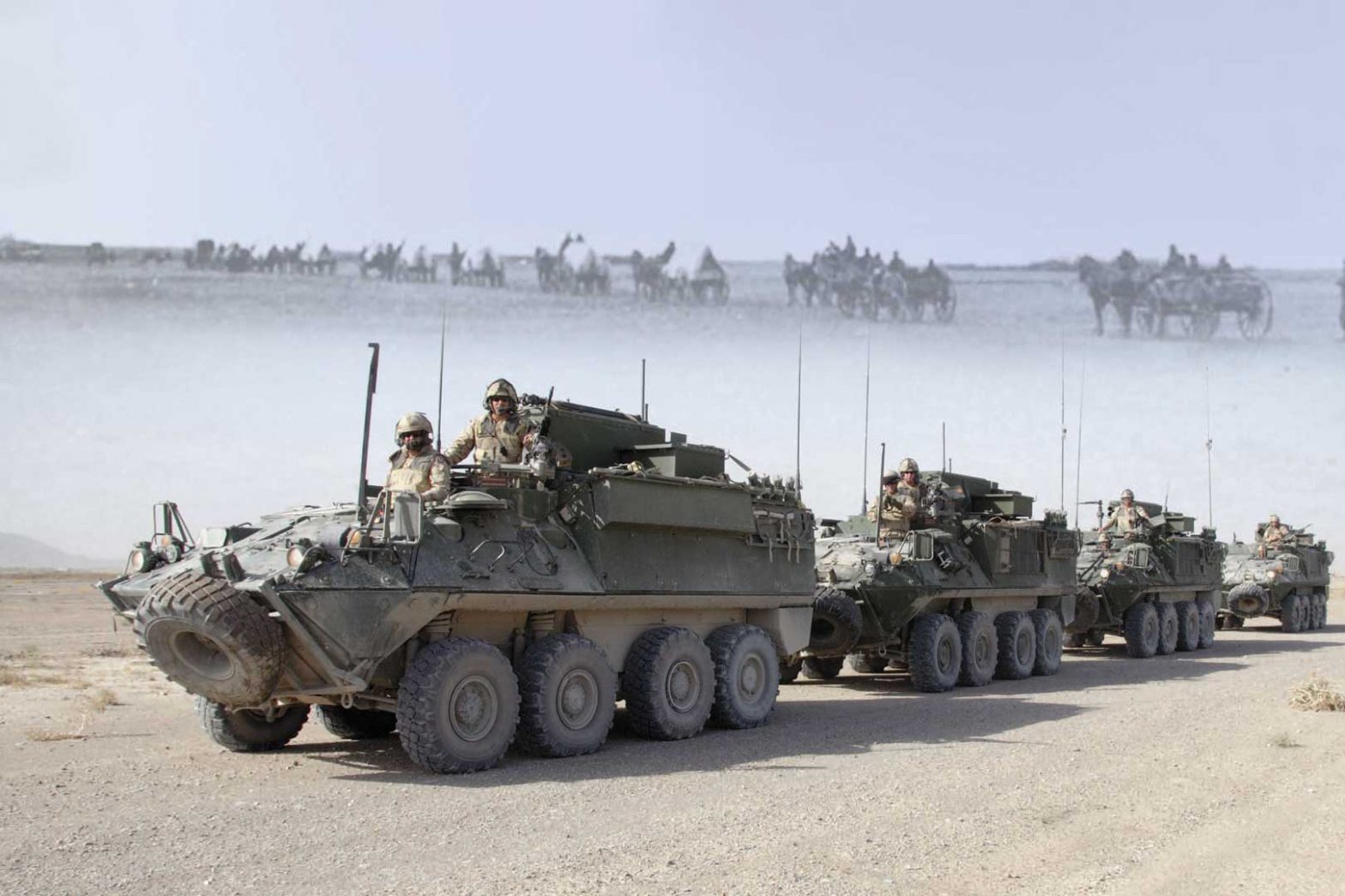 19th century wagon train heading away (backward) and a contemporary armoured vehicle convoy coming forward (foreground)