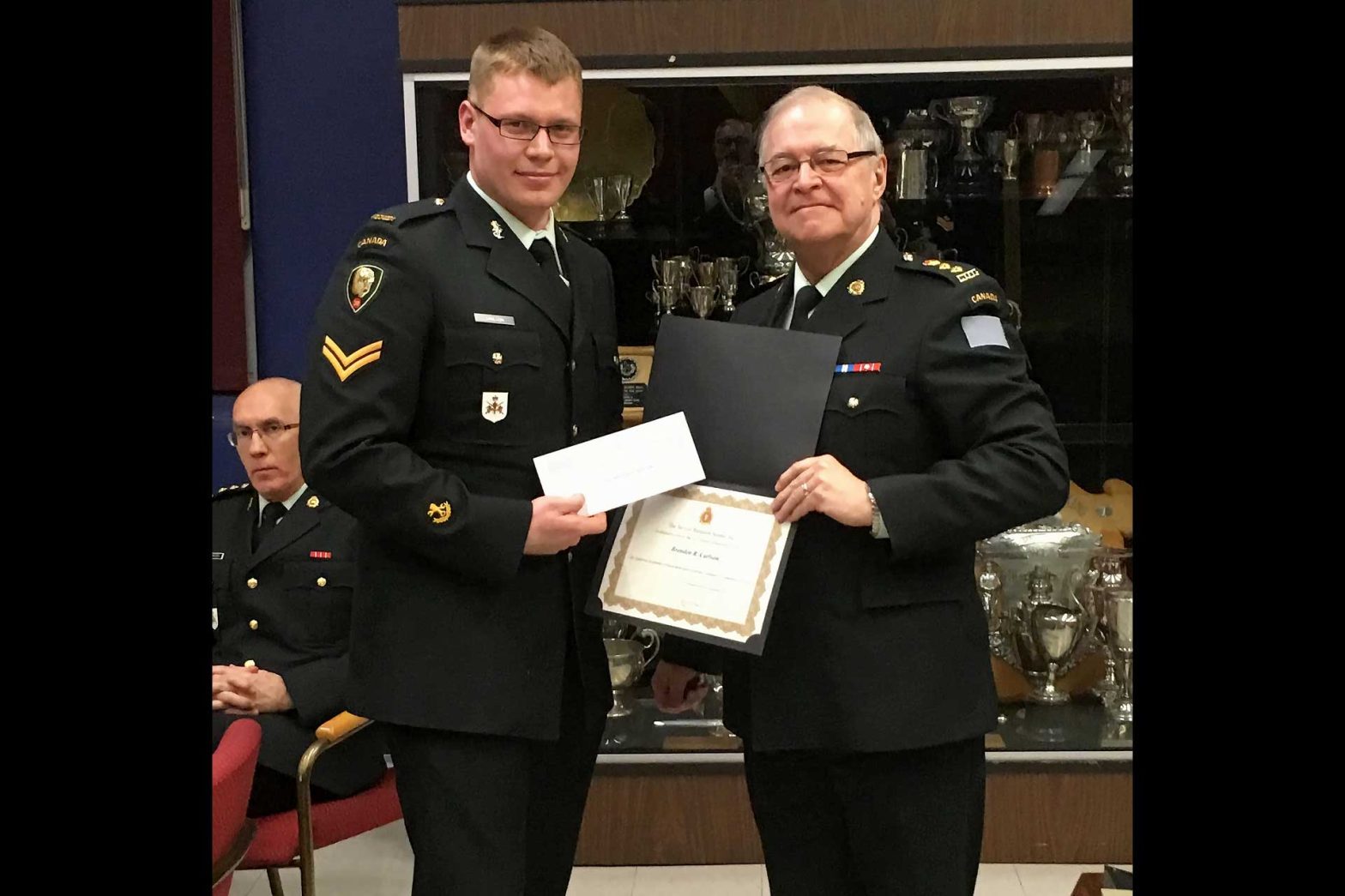HCol Watts presented the annual Senate Scholarship to Cpl Carlson.