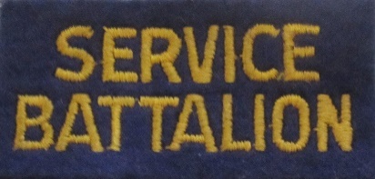 Cloth shoulder title for a “SERVICE BATTALION” – Blue with yellow lettering